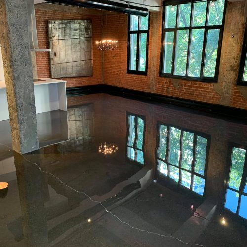 transparent-montreal alt="clear epoxy gives modern look in penthouse, mirror effect"