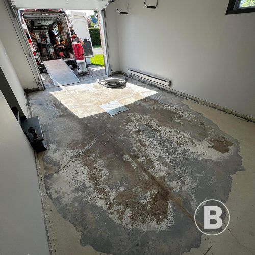 alt="old concrete slab in a garage"