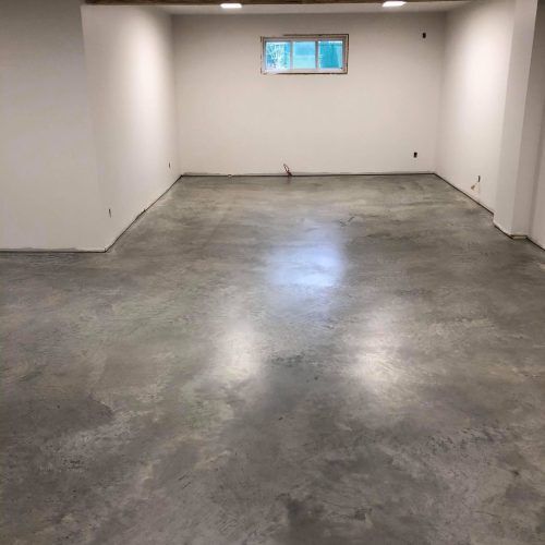 alt="basement with concrete sealer gives a modern look to your spaces"