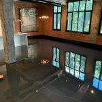 alt="clear epoxy gives modern look in penthouse, mirror effect"