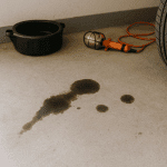 alt="oil stain on a concrete floor"